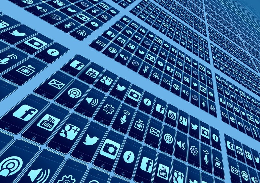 Stock illustration of a perspective grid of smartphone screens displaying app and social icons